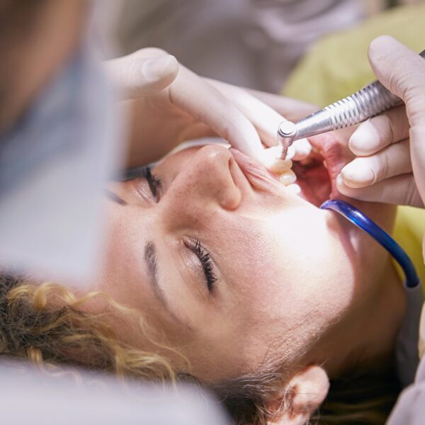 dentist in london performing oral surgery