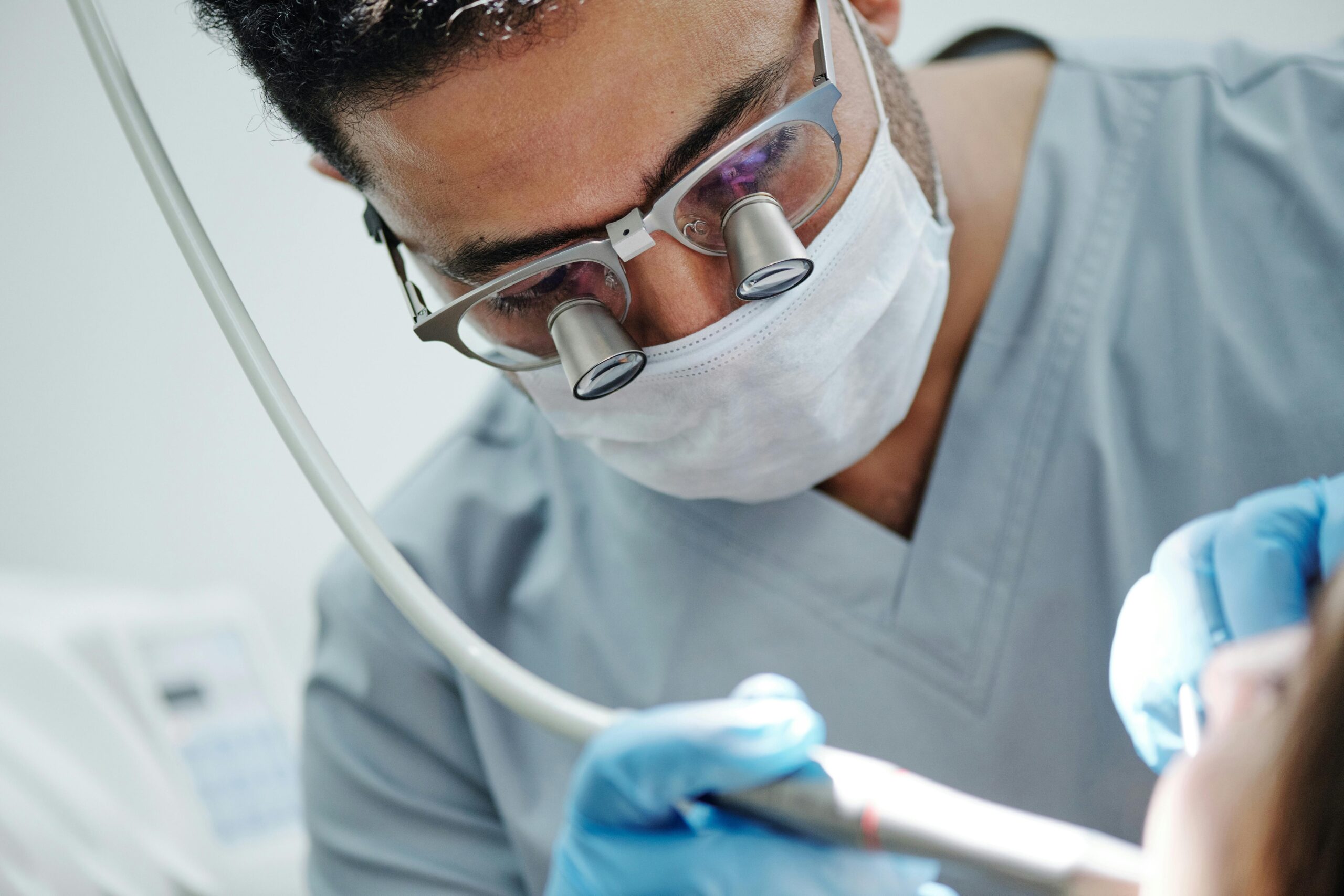 image of a dental surgeon doing dental implants in london