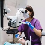 dentist using dental implant equipment