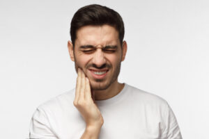 picture of a gentleman with dental pain, requiring IV sedation due to anxiety