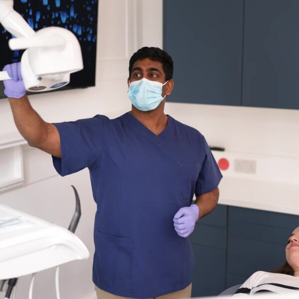 Dr James setting up to insert dental implant in london clinic