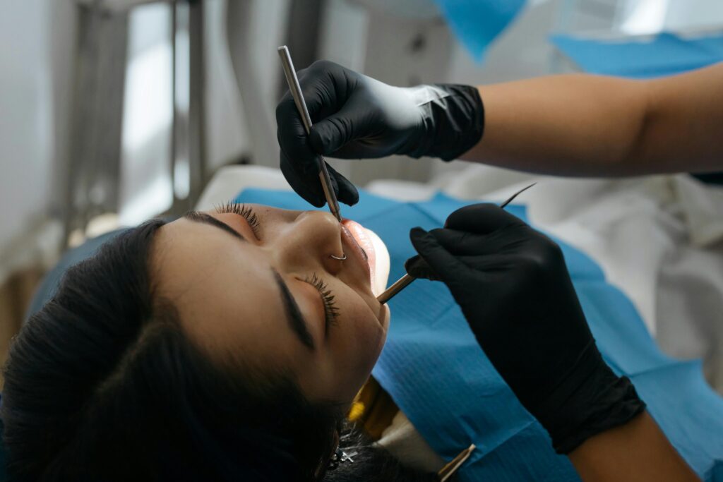 photo of dentist preparing for wisdom tooth extraction