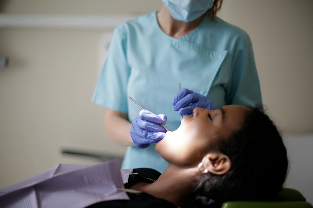 image of patient getting dental checkup following dental implant to check for dental implant healing