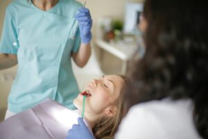 image of dentist preparing for dental implant