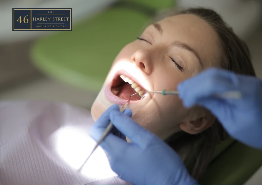 Woman having her teeth scraped