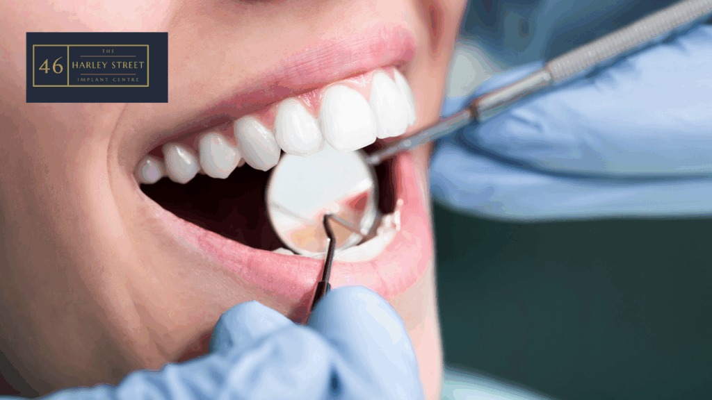 Patient opening mouth in a zoomed in image with dental mirror being held inside mouth as well as dental probe